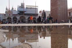 Water coming up through the manhole covers in Piazza San Marco.