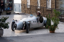 1938 Fiat racer and its driver who is probably also from 1938.